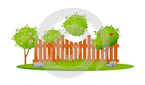 Beautiful wooden fence enclosing garden area with planting, lawn, trees.