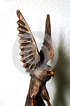 Beautiful wooden figure of an eagle on a white background