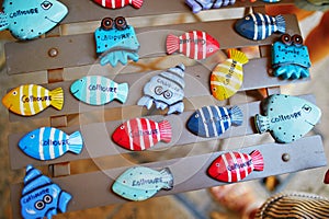 Beautiful wooden fishes for sale on a street of Mediterranean town of Collioure