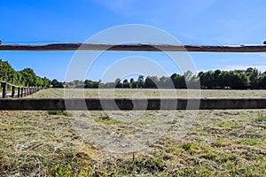 Beautiful wooden horse fence at an agricultural field