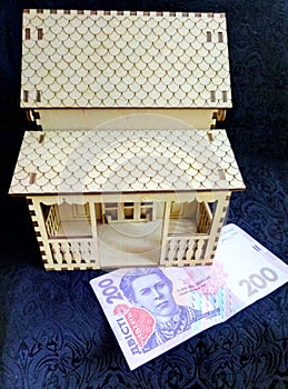 Beautiful wooden house and money