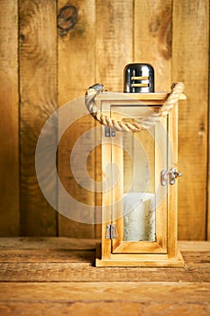 Beautiful wooden lantern on background of old wooden boards