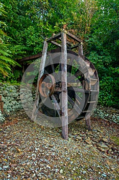 Beautiful wooden paddle wheel driven watermill inside the forest in south island, in New Zealand