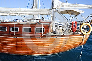 Beautiful wooden sailboat on blue sea