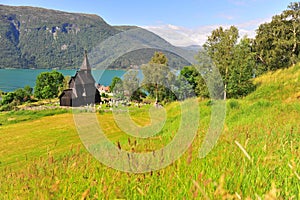 Beautiful wooden stave church on fjords