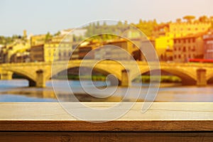 Beautiful wooden table on the background of italian florence during sunset. Copy space. Product demo template concept