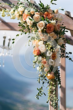 Beautiful wooden wedding arch decorated with flowers