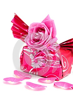 Beautiful wrapped gift with rose