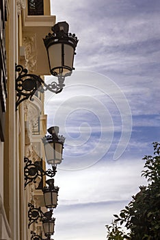 Beautiful wrought iron street lamps. Old house on the street of the Spanish city of Ronda. Early morning