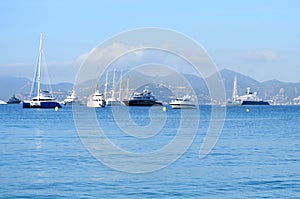 Beautiful yachts on a sparkling blue sea in Cannes, France