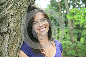 Beautiful 30 years old woman standing in forest