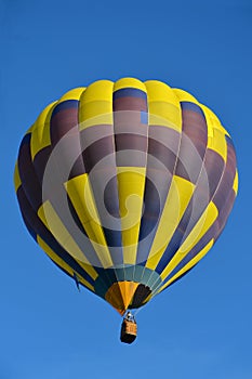 Beautiful yellow blue hot air balloon in blue sky