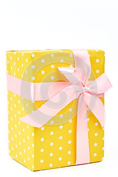 Beautiful yellow gift box close up.