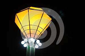 A beautiful yellow steetlight on a black background