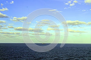 Beautiful yellow tinted clouds and blue skies in the Caribbean ocean