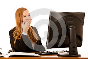 Beautiful youn g business woman yawning on work in office - exaustion on work photo