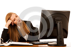 Beautiful youn g business woman yawning on work in office - exaustion on work photo