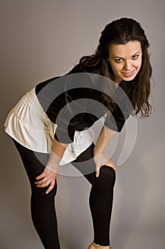 Beautiful young adult girl in black elegant dress