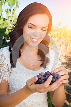Beautiful Young Adult Woman Enjoying A Walk In a Grape Vineyard