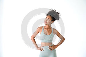 Beautiful young African American girl posing with fitness clothes isolated over white background. Healthy and Fitness concept