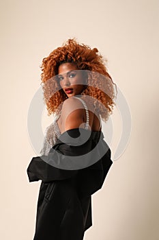 Beautiful young African American woman with afro hairstyle. Vertical mock-up.