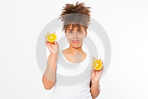 Beautiful young african american woman isolated with oranges on white background. Afro girl and diet concept. Copy space. Skin