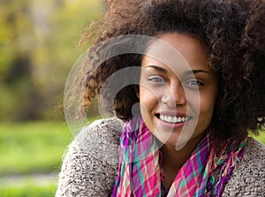 Beautiful young african american woman smiling outdoors