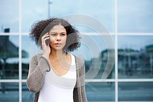 Beautiful young african american woman using cellphone