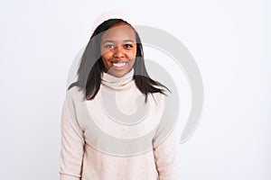 Beautiful young african american woman wearing turtleneck sweater and winter hat with a happy and cool smile on face