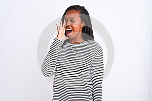 Beautiful young african american woman wearing winter sweater over isolated background shouting and screaming loud to side with