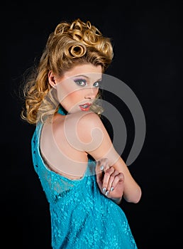 Beautiful young american girl in retro style, pinup. Caucasian blond model posing in retro fashion and vintage concept