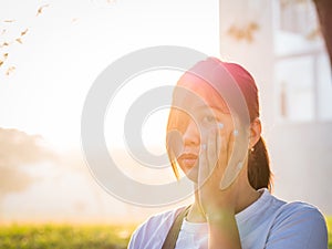 Beautiful Young Asian - Chinese Woman Holding Cheek, Have A Toot