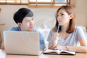 Beautiful young asian couple calculate expenses finance with laptop and planning together