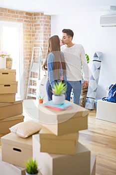 Beautiful young asian couple looking happy and smiling excited moving to a new home