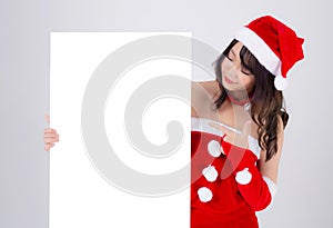 Beautiful young asian Santa woman holding blank board for xmas isolated on white background