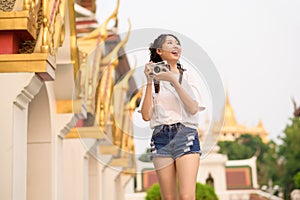 Beautiful young Asian tourist woman on vacation sightseeing and exploring Bangkok city, Thailand, Holidays and traveling concept