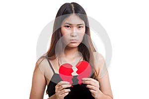 Beautiful young Asian woman with broken heart.