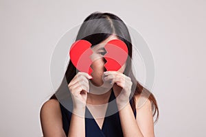 Beautiful young Asian woman with broken heart.