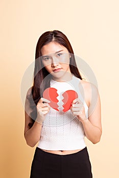 Beautiful young Asian woman with broken heart