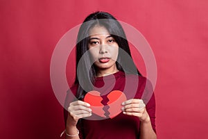 Beautiful young Asian woman with broken heart