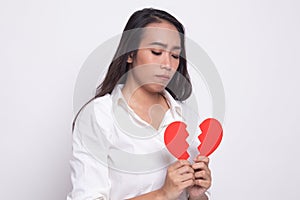 Beautiful young Asian woman with broken heart