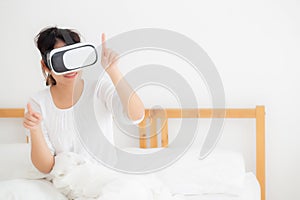 Beautiful young asian woman cheerful and fun wearing vr virtual reality headset, girl device and watching simulator game