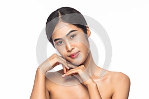 Beautiful Young Asian woman clean fresh skin with hands touching face isolated on white background.