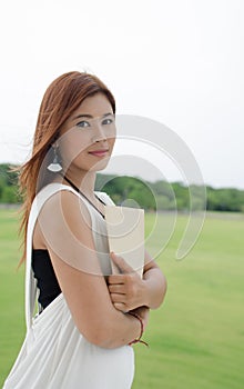 Beautiful young Asian woman in the countryside