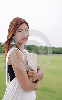Beautiful young Asian woman in the countryside