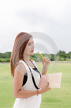 Beautiful young Asian woman in the countryside