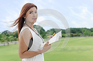 Beautiful young Asian woman in the countryside