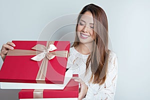 Beautiful young asian woman holding a present