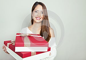 Beautiful young asian woman holding a present