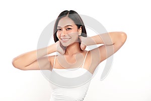 Beautiful Young Asian woman lifting hands up to show off clean and hygienic armpits or underarms on white background, Smooth